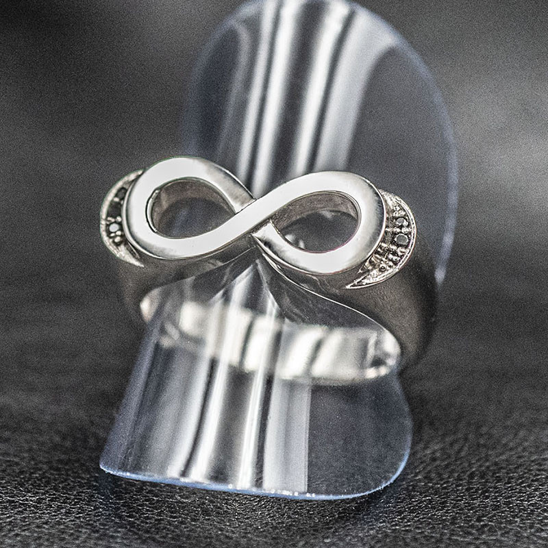 Infinity ring with black stones