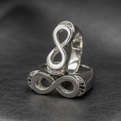 Infinity ring with black stones