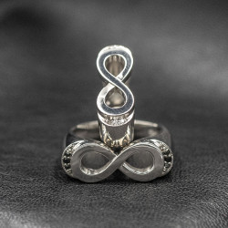 Infinity ring with black stones